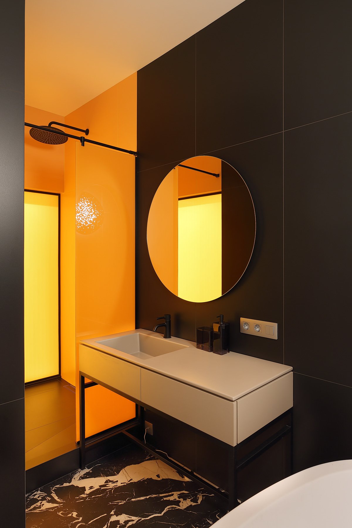 Bathroom vanity with amber accent lighting.