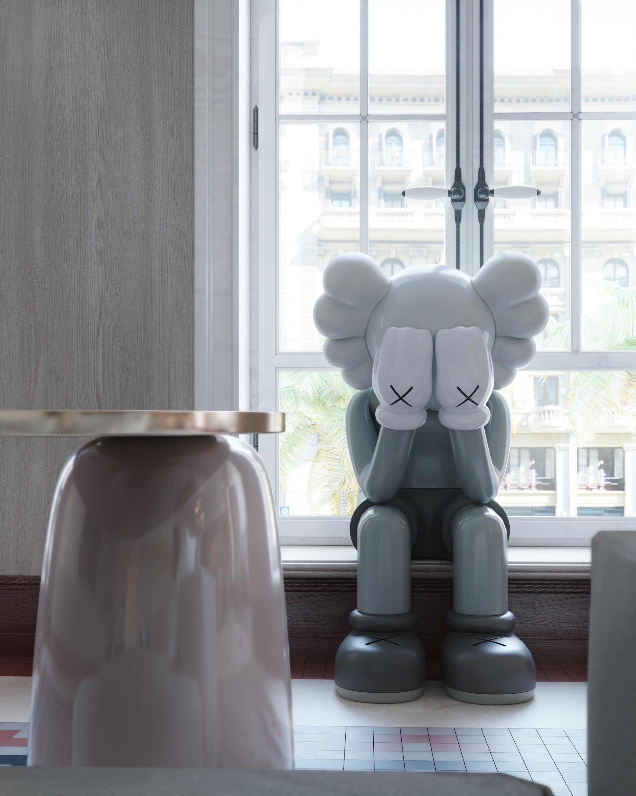 Styling detail with collectible figurines on a side table against the window.