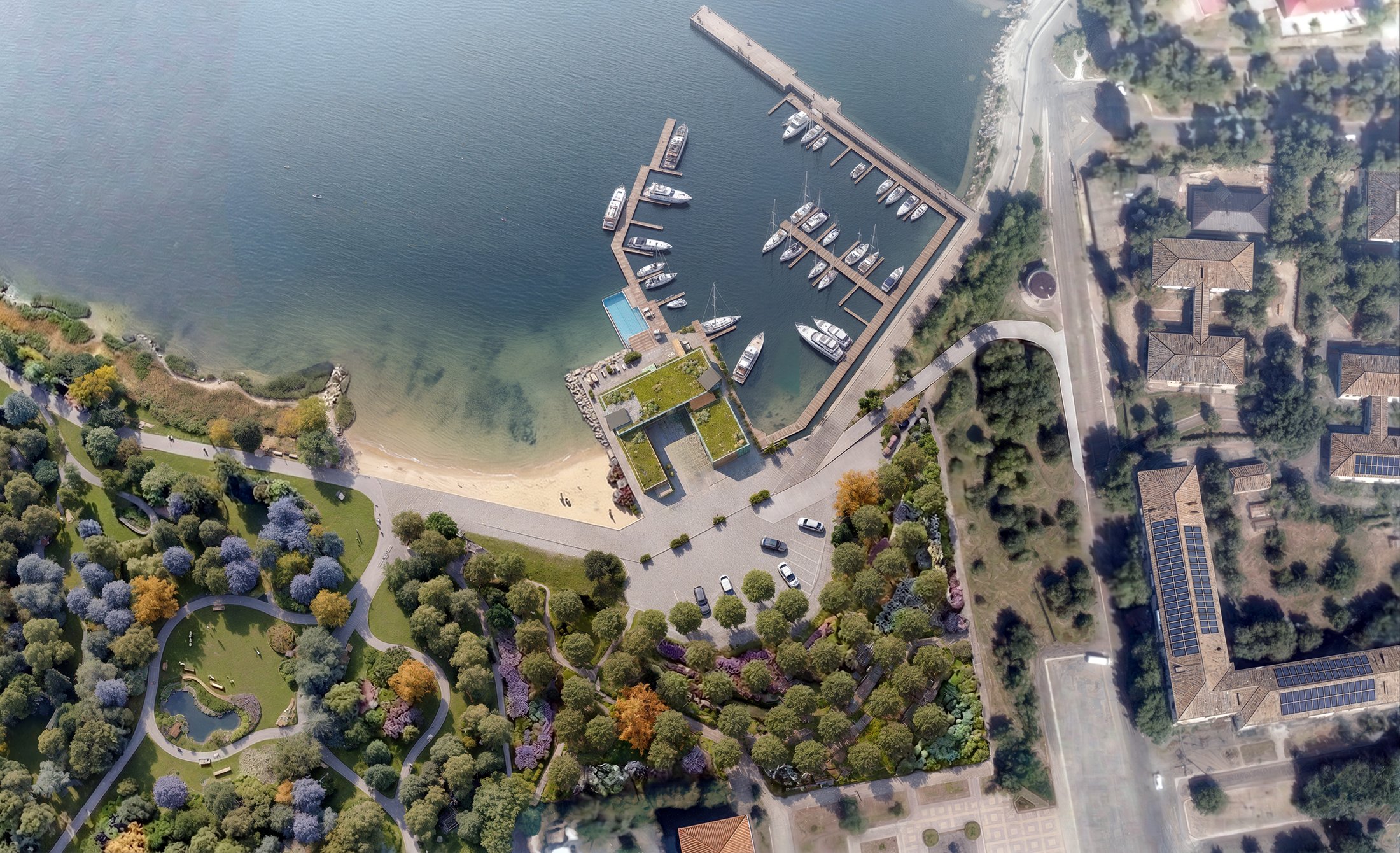 Aerial site plan showing the complex between the marina, beach and landscaped park.