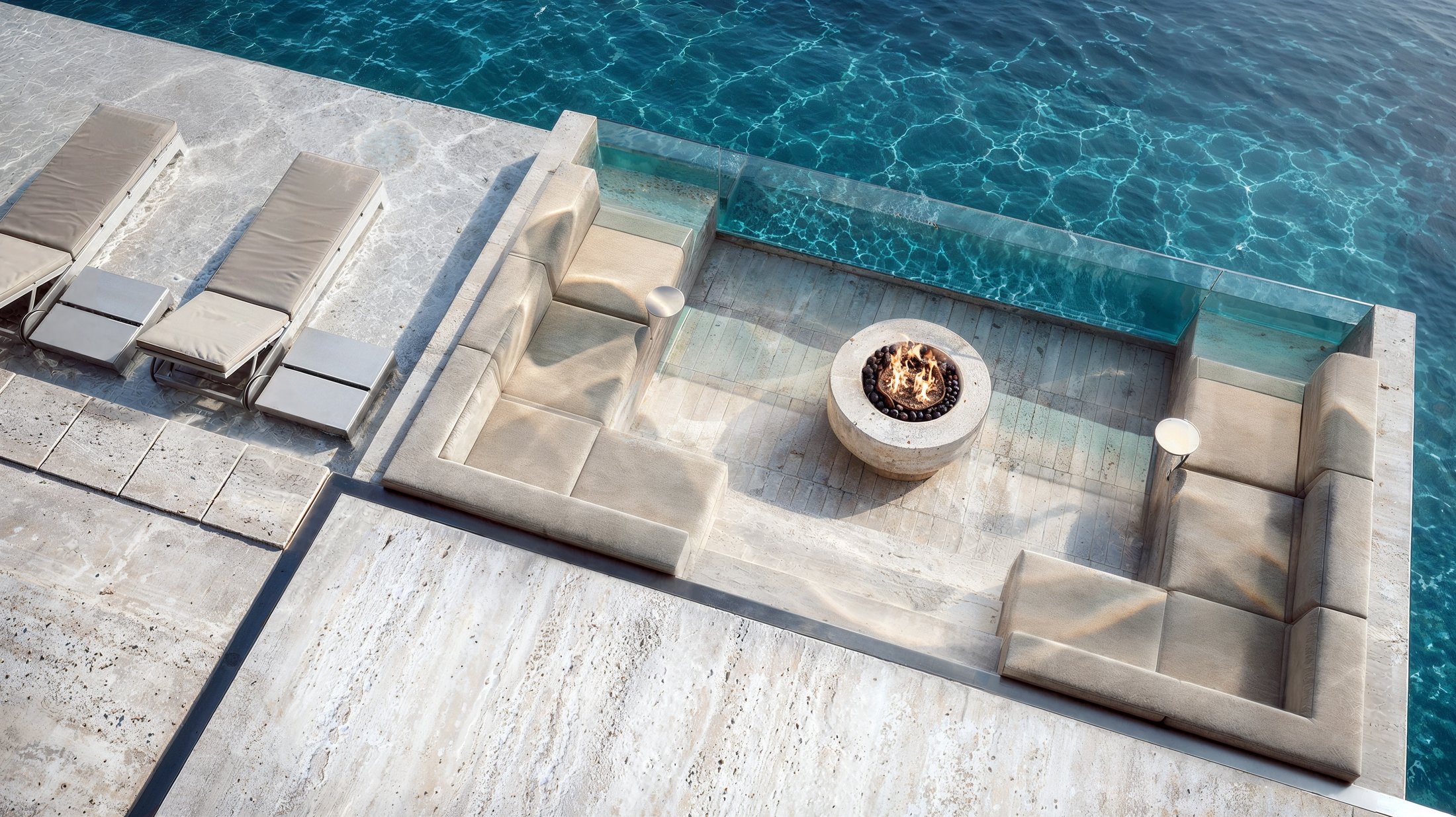 Aerial view of the villa's travertine pool terrace and lakeside landscaping.