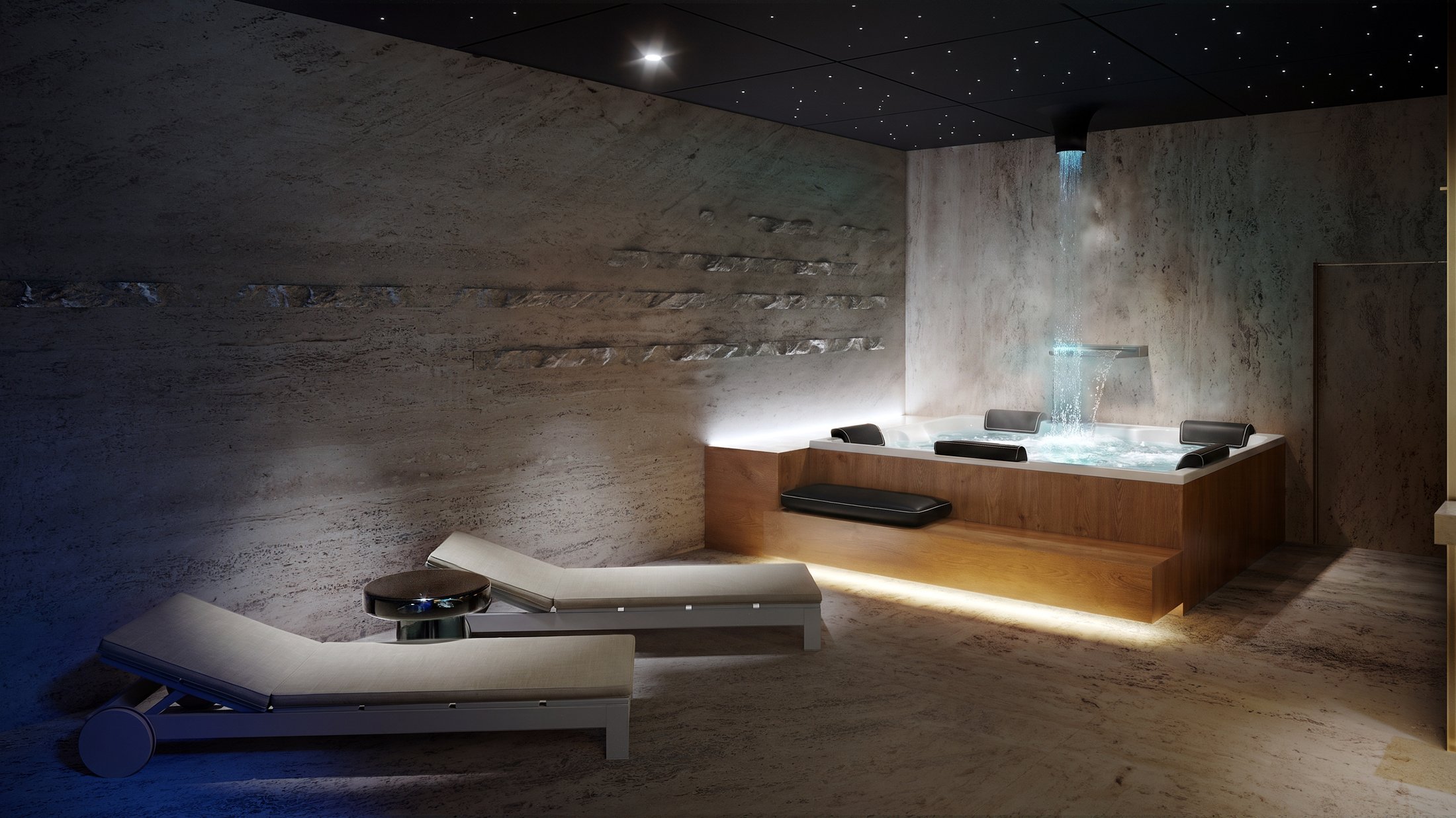 Spa relaxation area with a blue-lit plunge tub and loungers.