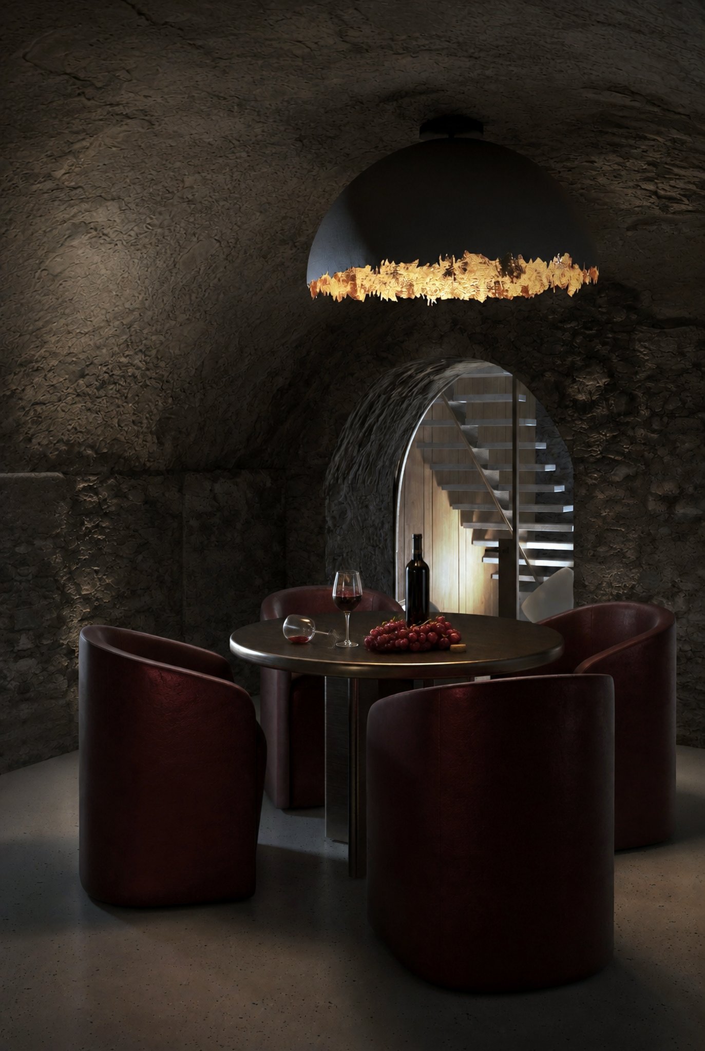 Wine cellar dining nook beneath a stone archway.